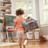 Child carrying the travel play mat