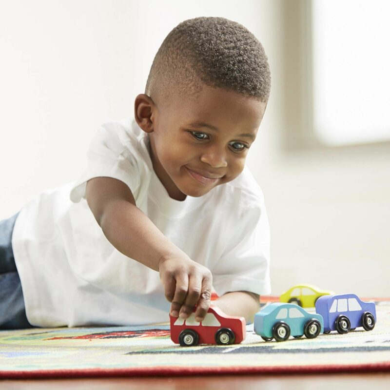 Kid Playing on Town map rug