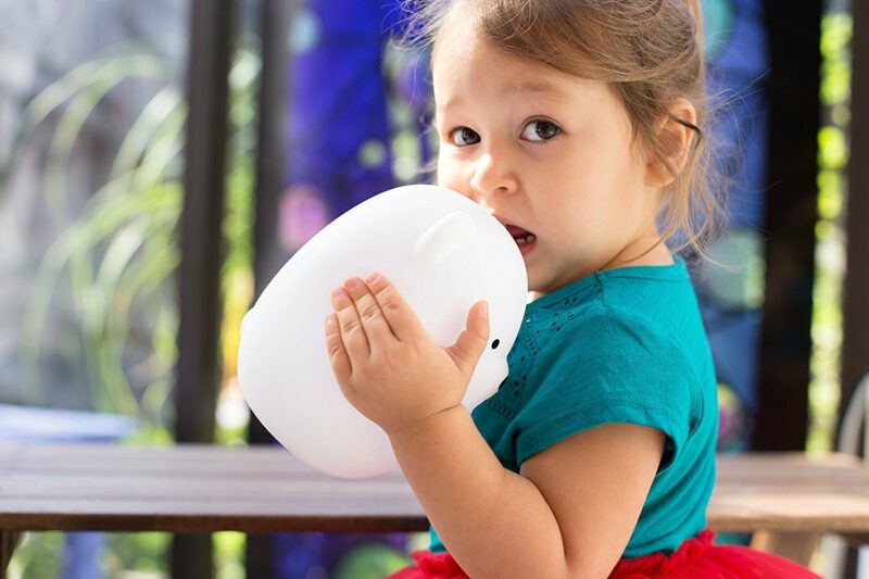 Girl Chewing on LumiPets Bear Nightlight with Remote