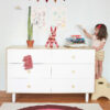 Oeuf Rainbow Rug in front of the Oeuf Fawn Dresser