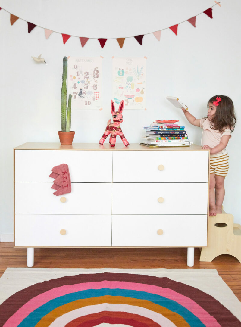 Oeuf Rainbow Rug in front of the Oeuf Fawn Dresser