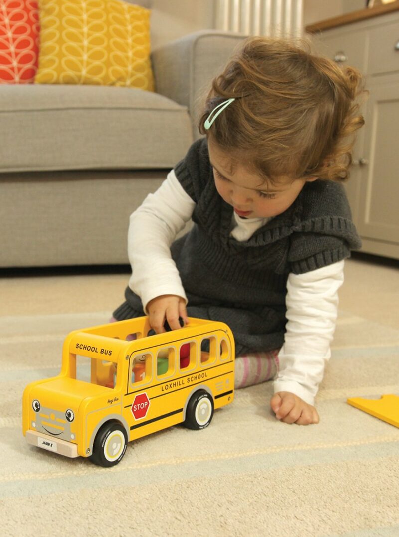 Kid playing with this indigo jamm school bus