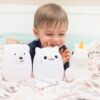 Boy Playing with LumiPets Bear, Cat, and Unicorn Nightlight with Remote