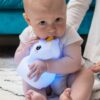 Baby Chewing on LumiPets Unicorn Nightlight with Remote