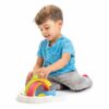 Kid playing with rainbow stacking toy