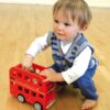 Kid playing with bernie's number bus