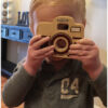Toddler Playing Photographer with Wooden Camera