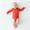 Kyte BABY Long Sleeve Bodysuit in Clementine