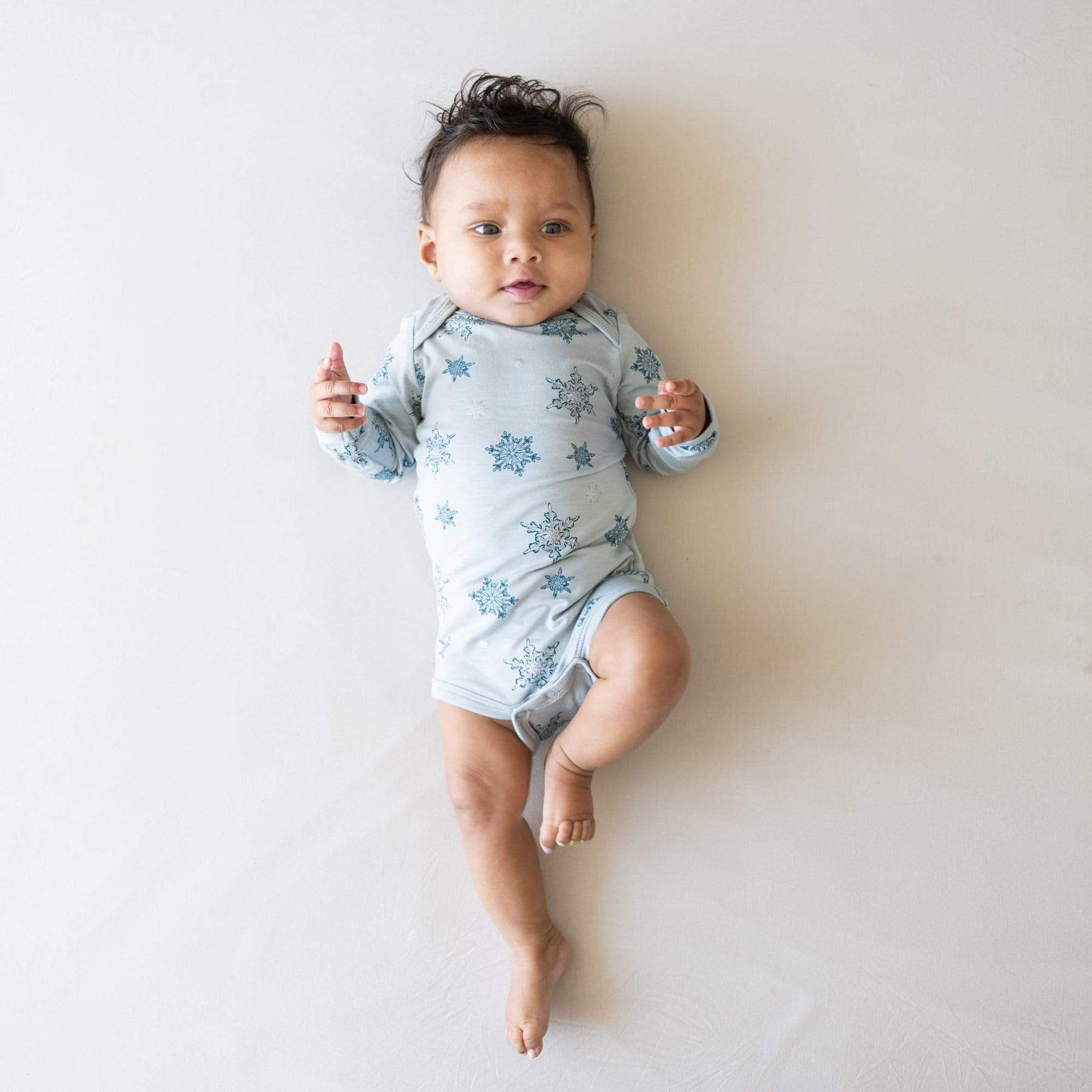 Kyte BABY Long Sleeve Bodysuit in Snowflake Blossom