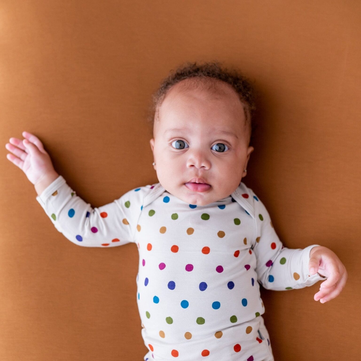 Kyte BABY Long Sleeve Bodysuit in Oat Polka Dot Blossom
