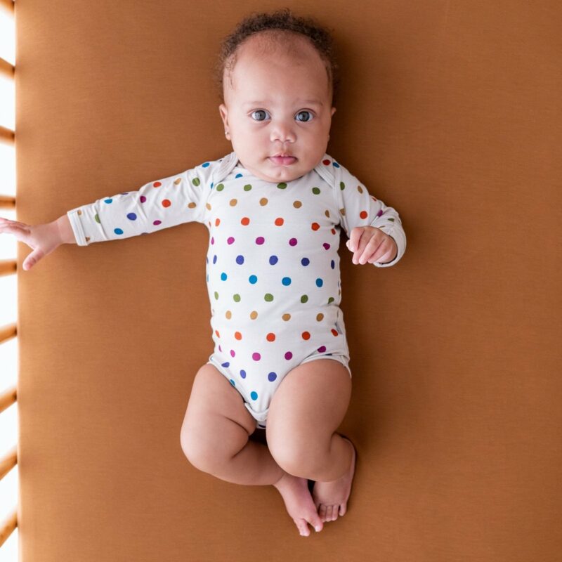 Kyte BABY Long Sleeve Bodysuit in Oat Polka Dot Blossom