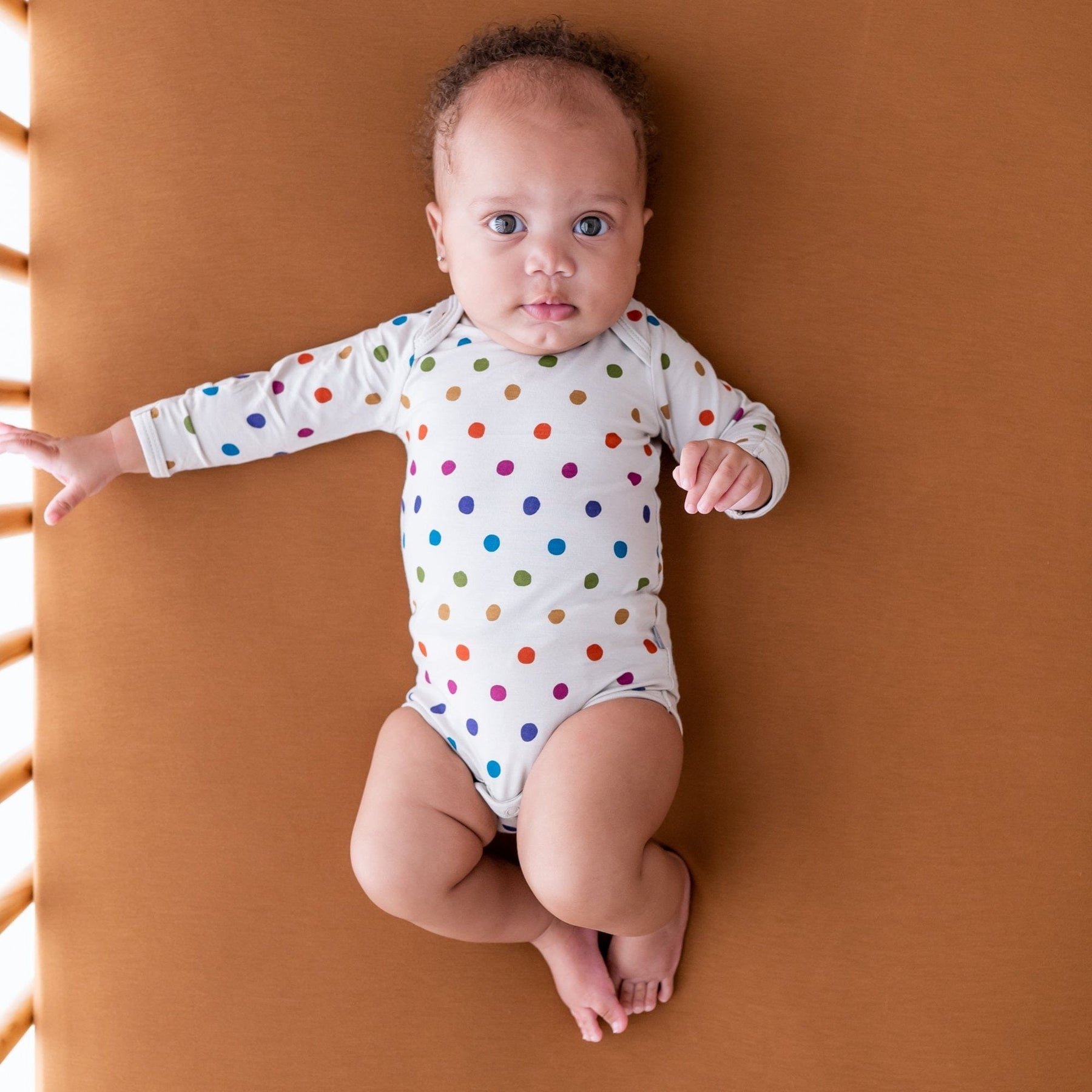 Kyte BABY Long Sleeve Bodysuit in Oat Polka Dot