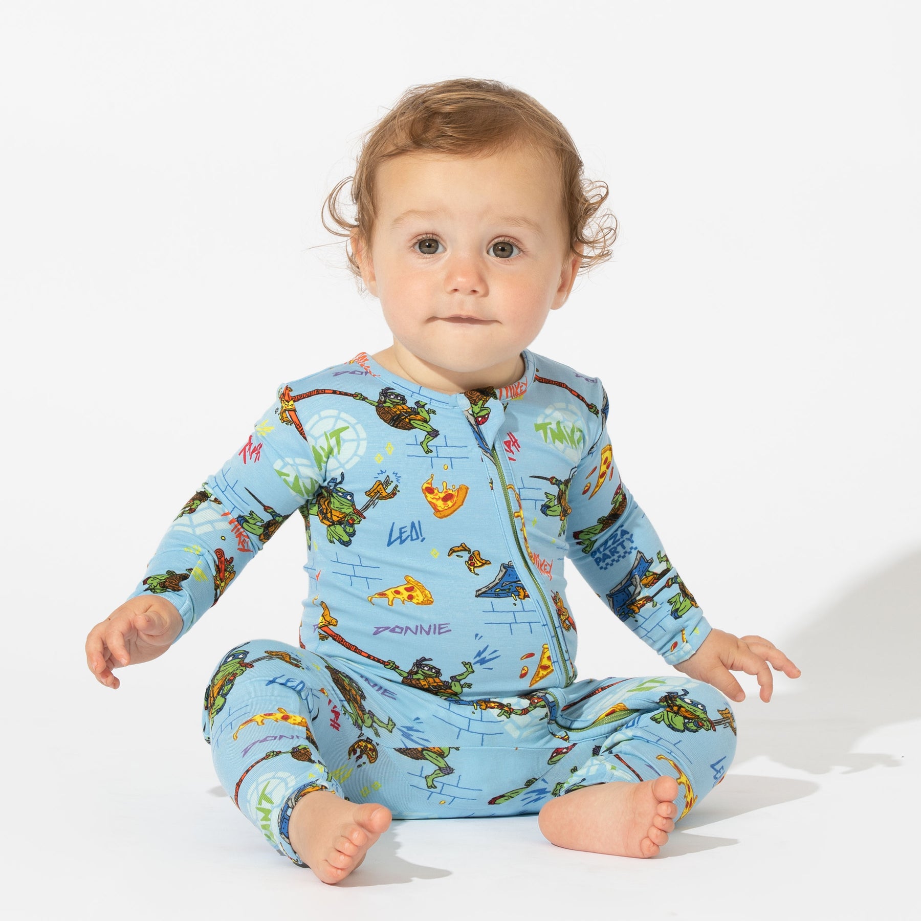 https://www.blossom.baby/wp-content/uploads/2023/08/TMNT-Movie_-Teenage-Mutant-Ninja-Turtles_-Mutant-Mayhem-Convertible-Footie_-Onesie_-Romper_-Infant_-Bellabu-Bear-Bamboo-Pajamas_-Family-Matching-PJs_-Baby-Clothes_-Eczema-Safe2_1800x1800.jpg