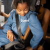 Nuna LUMN lifestyle photo in seat belt booster mode