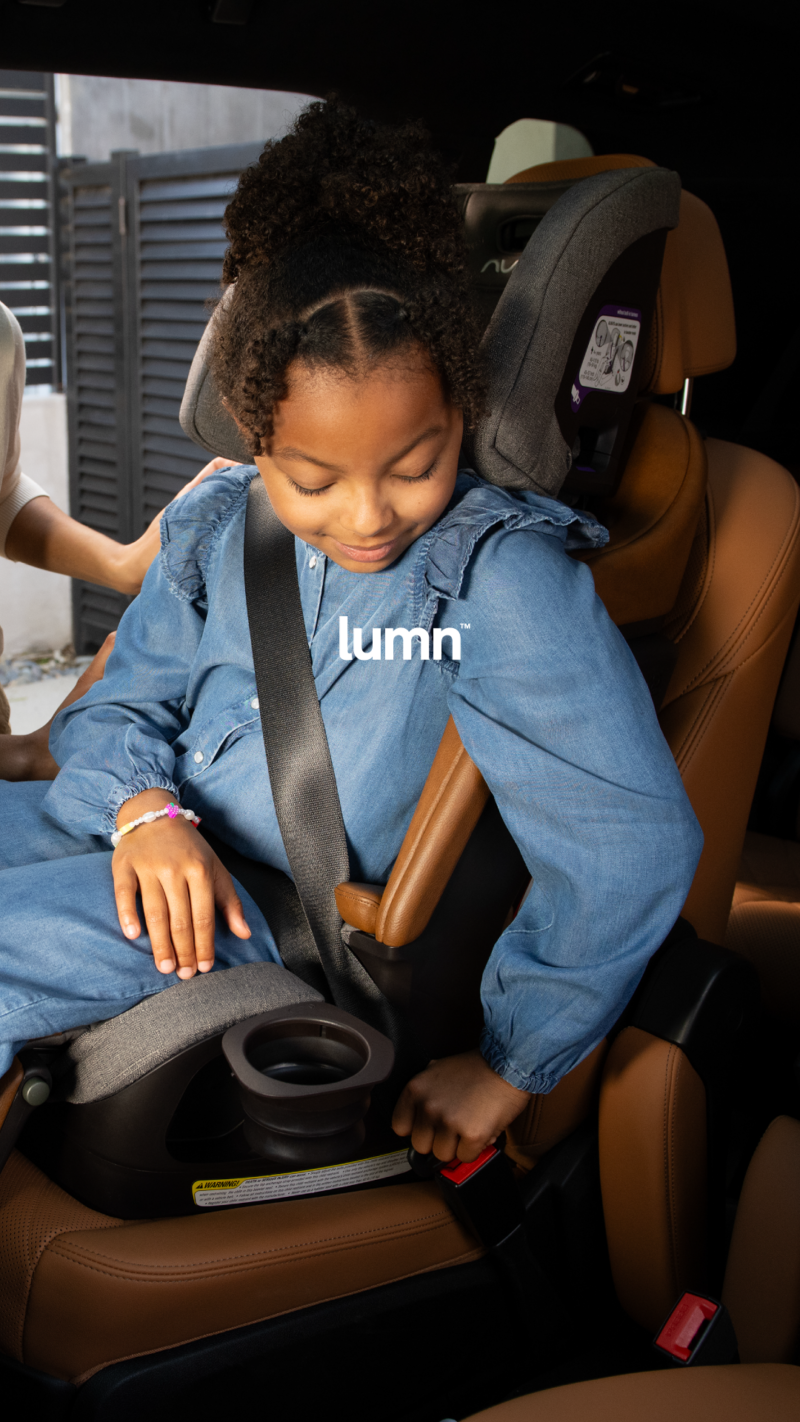 Nuna LUMN lifestyle photo in seat belt booster mode