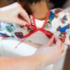 Sleeved Bib: Super Mario Classic made by Bumkins