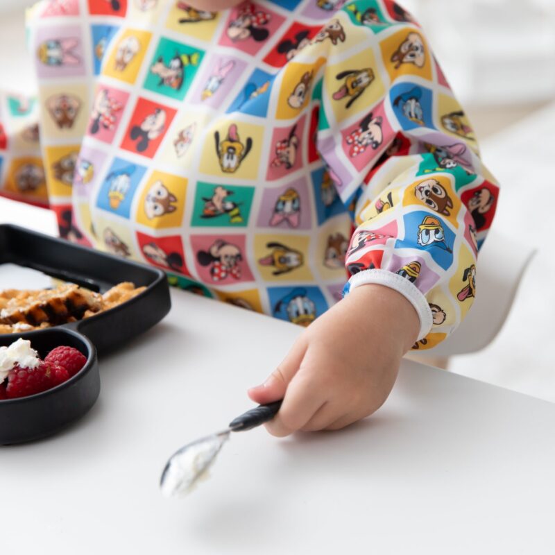 Sleeved Bib: Mickey & Friends Check Mates from Bumkins