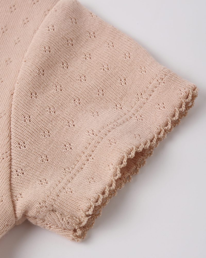 Pointelle Skirted Bodysuit In Melon available at Blossom Pointelle Skirted Bodysuit In Melon available at Blossom