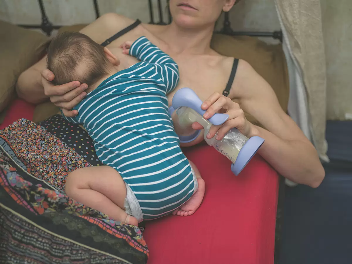 Breastfeeding Mom Nursing and Hand Pumping